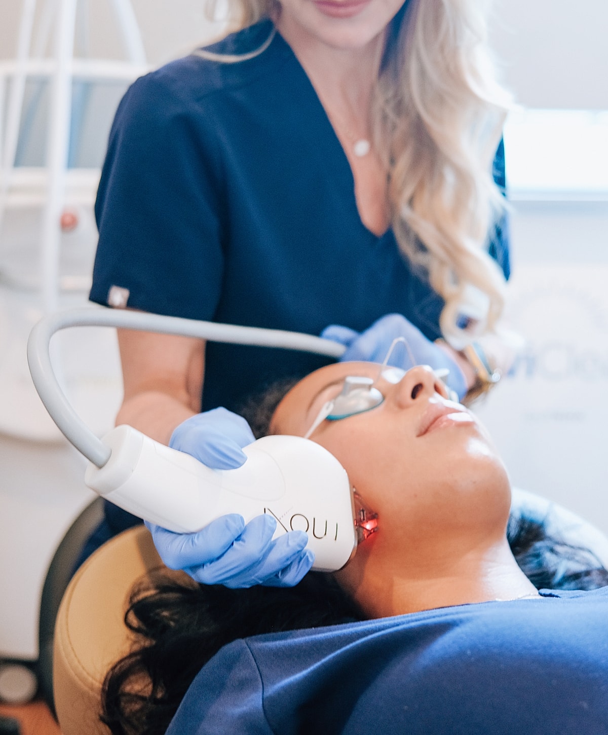 Facial treatment in a skincare clinic setting.