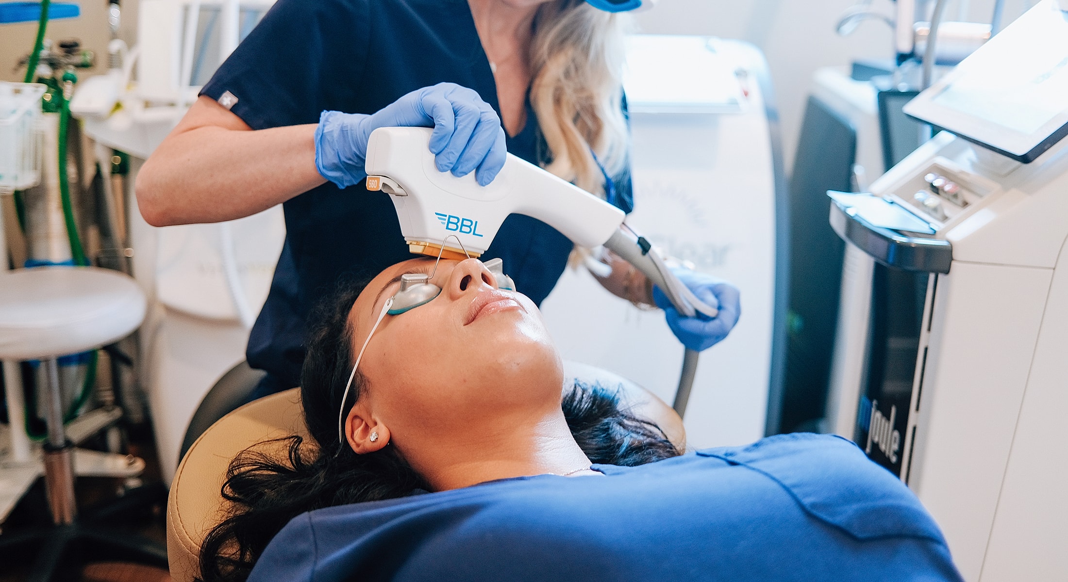 Woman receiving BBL treatment in a clinic.