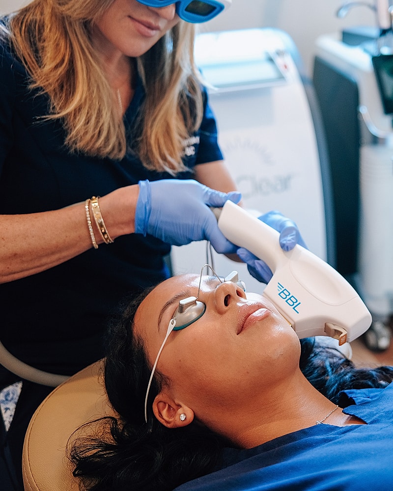 Laser treatment session at a skincare clinic.
